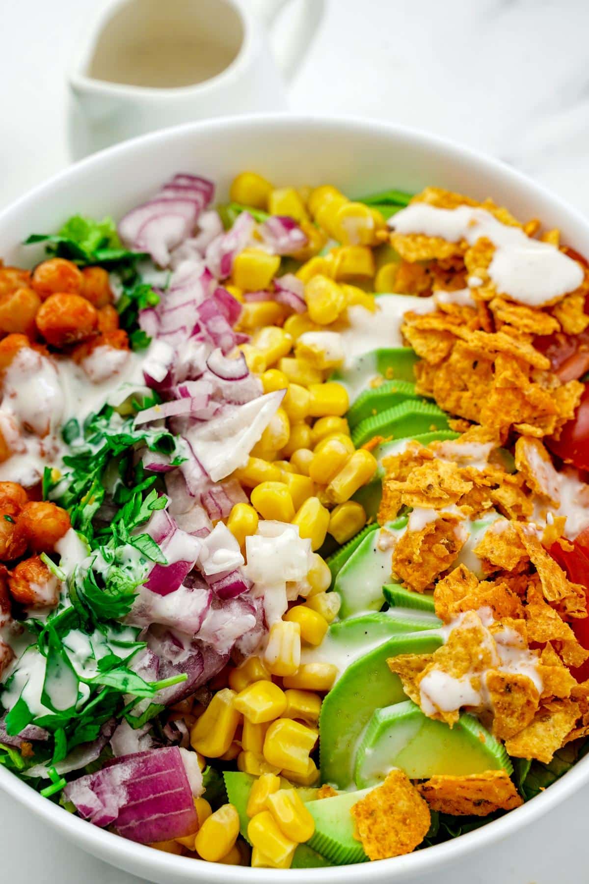 top of bbq chickpea chopped salad bowl on marble table