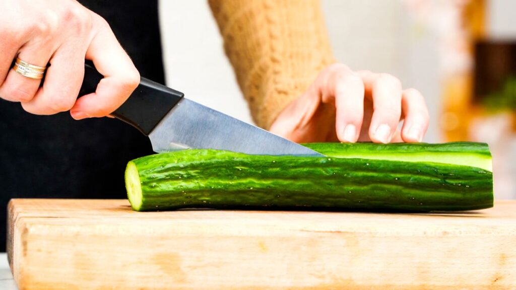 knife slicing cucumber