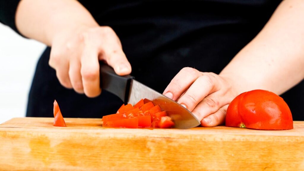 tomatoes being died on cutting board