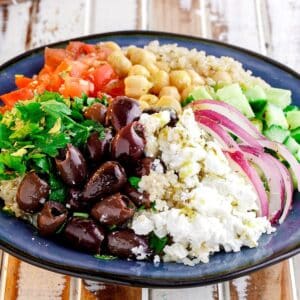 blue plate of ingredients for quinoa salad