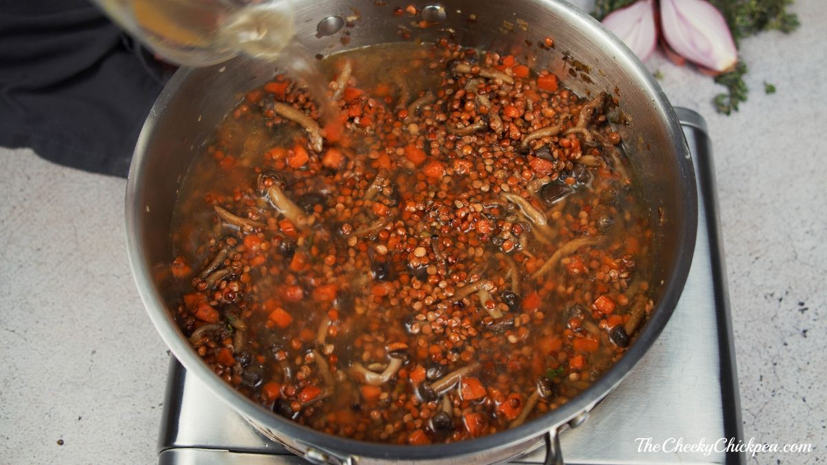 lentil stew simmering in skillet