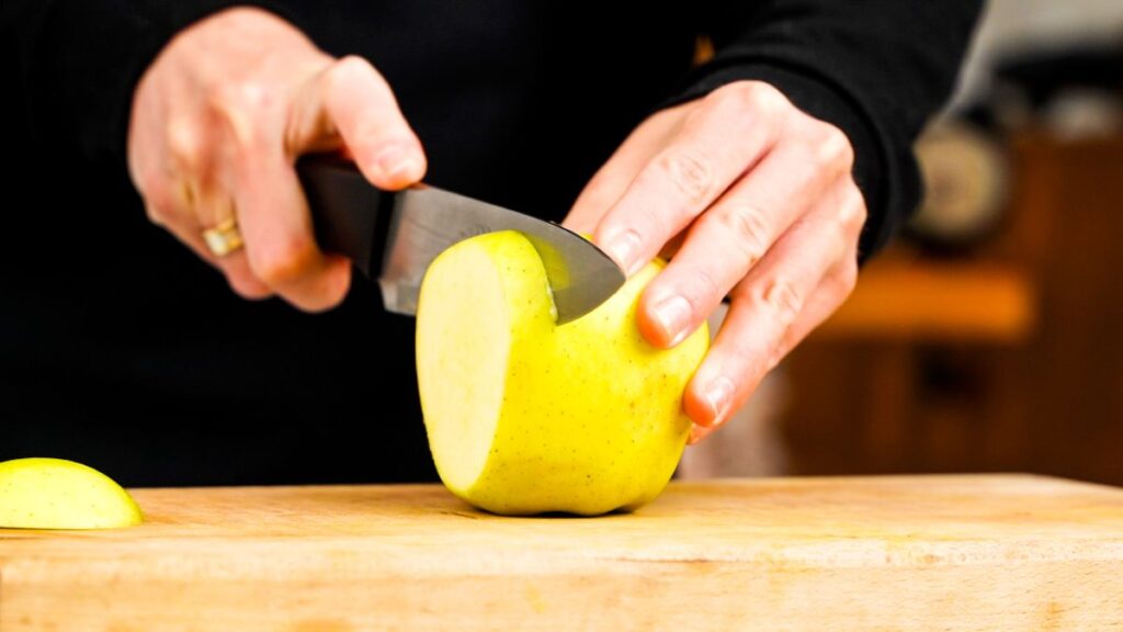 knife slicing apple
