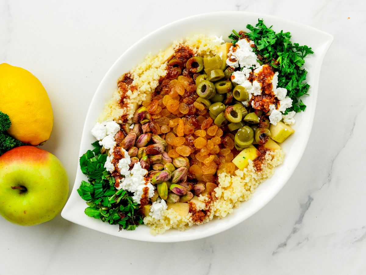 white platter of couscous and vegetables