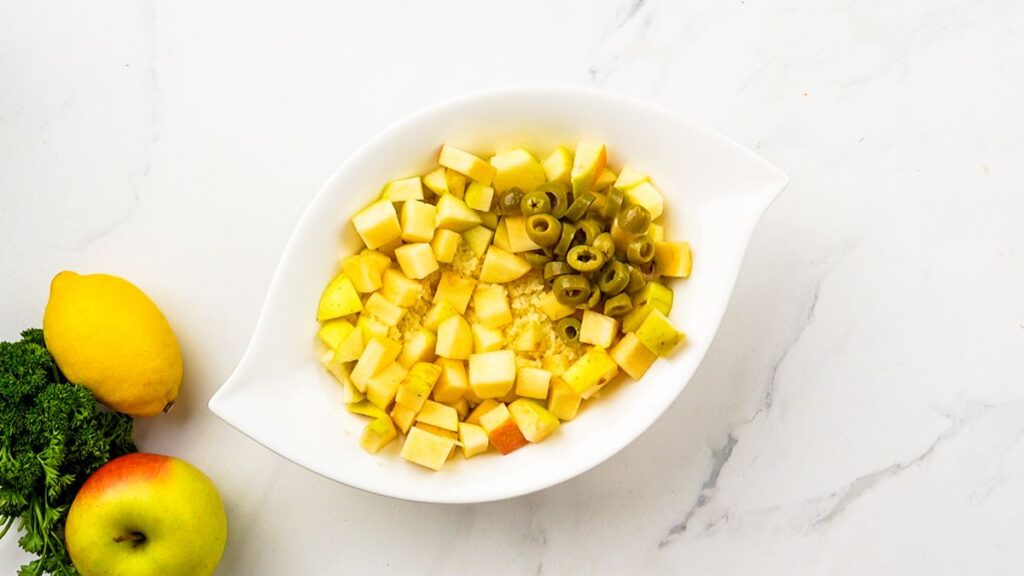 potatoes and olives in white bowl