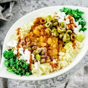 oval white platter of morroccan couscous salad