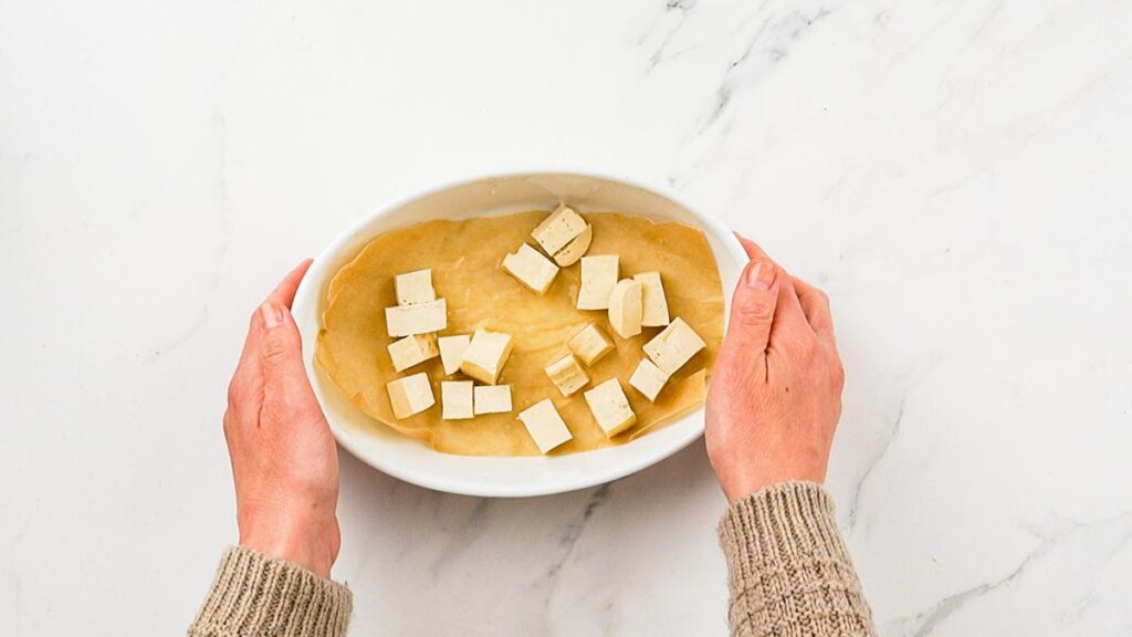 tofu cubes in white baking dish