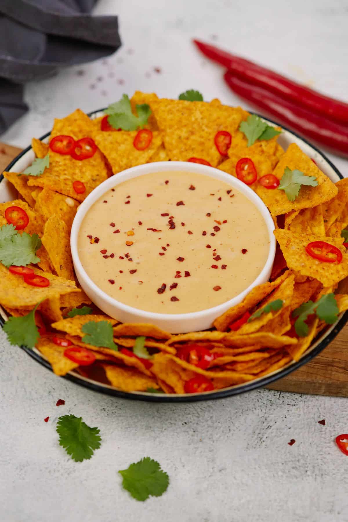 chips on platter with white bowl of dip in the center