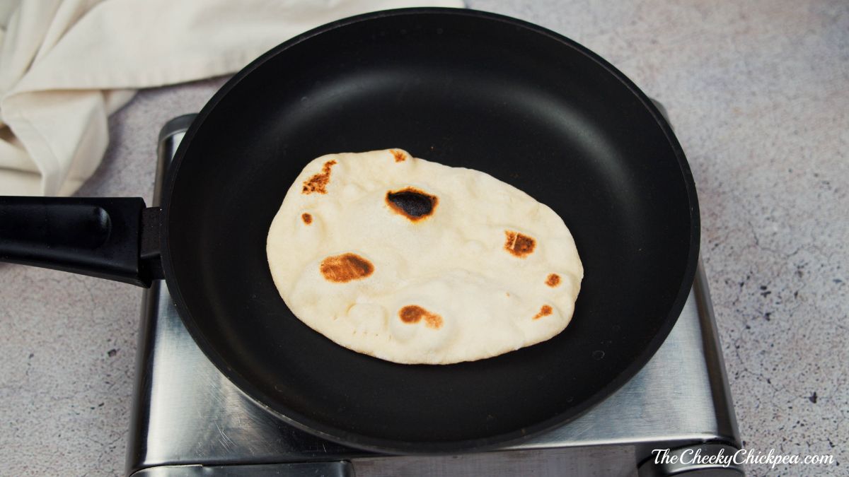 naan in skillet on hot plate