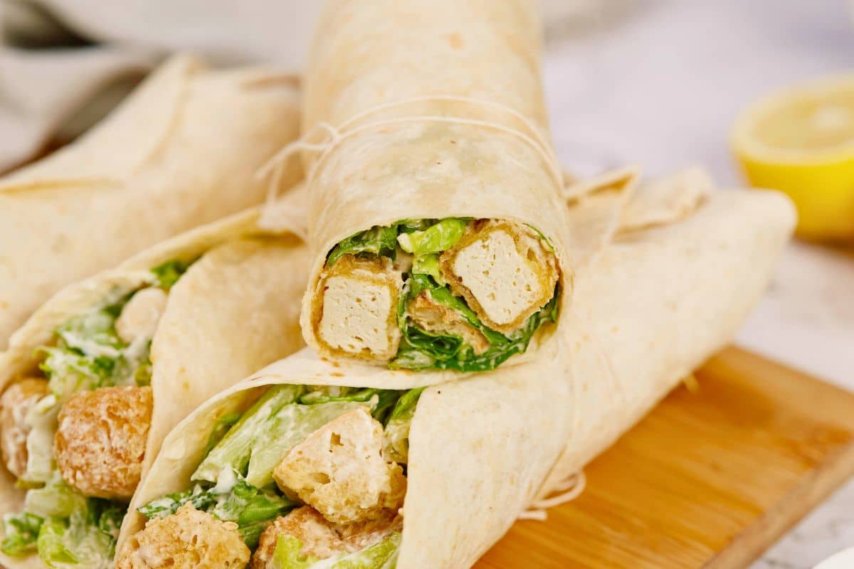 two wraps stacked on top of each other showing slices of tofu inside