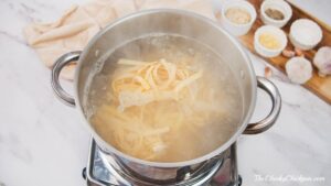 pasta being cooked in stockpot