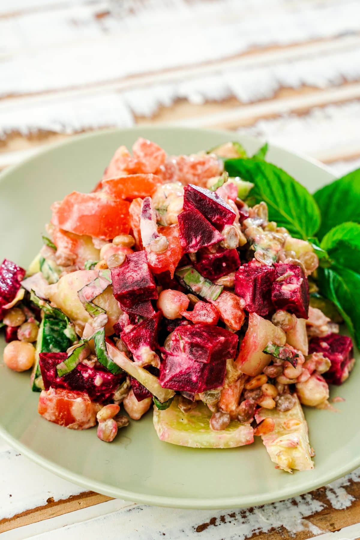 salad with beets on light green plate