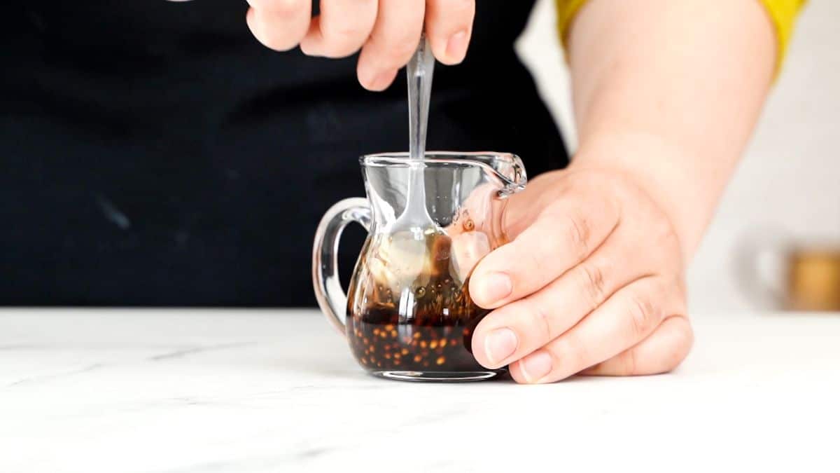 dressing being whisked together in jar