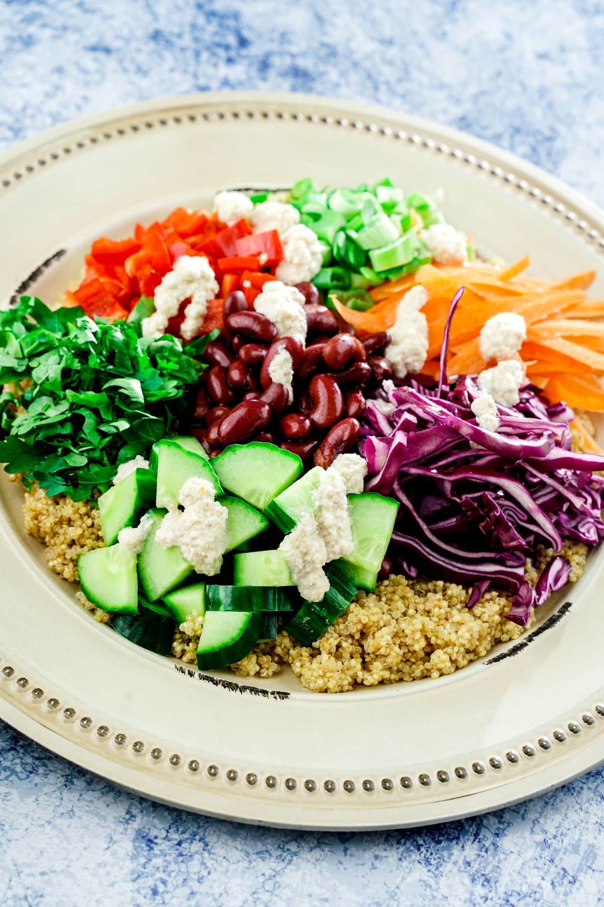 plate of salad with bright vegetables on top