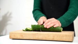 cucumber being sliced